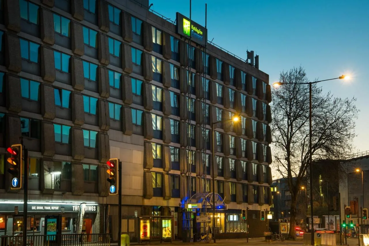a tall building on a city street at night at Holiday Inn Express Bristol City Centre by IHG in Bristol